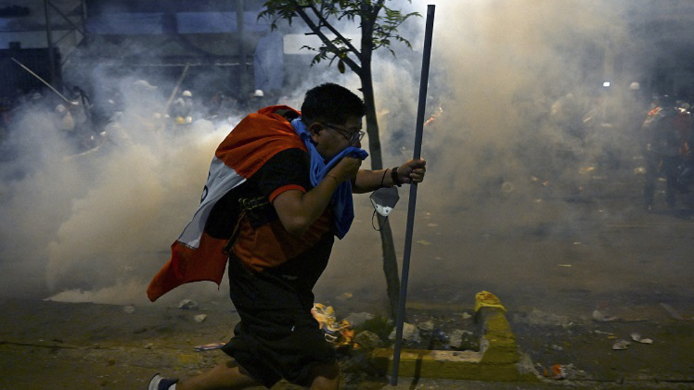 Dozens injured as Peru police attack protesters demanding president resign 