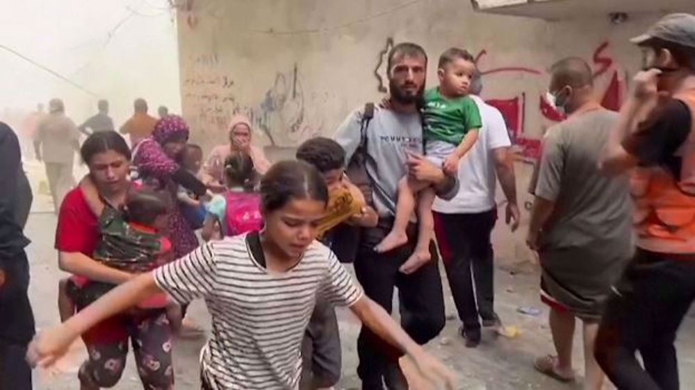 Children, families seen escaping site of Israeli airstrike in Gaza