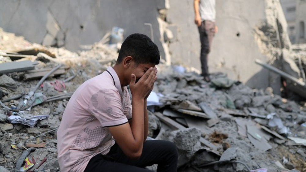 Palestinians hold funerals for scores of civilians killed in Israeli strikes on Gaza refugee camps