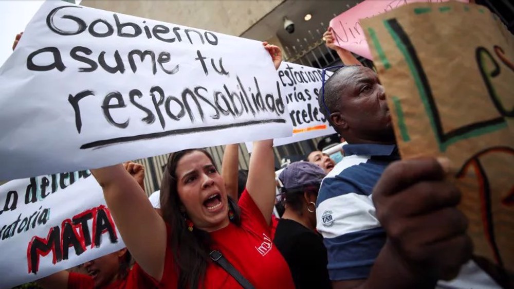 Mexico opens homicide probe as death toll from migrant blaze rises