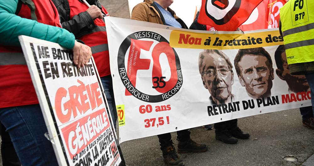 France’s Macron signs pension reforms into law despite months of protests 