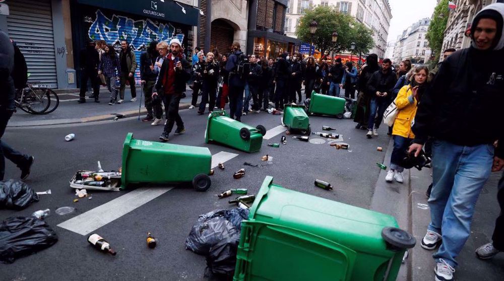 French protesters clash with police as Macron defends pension reform