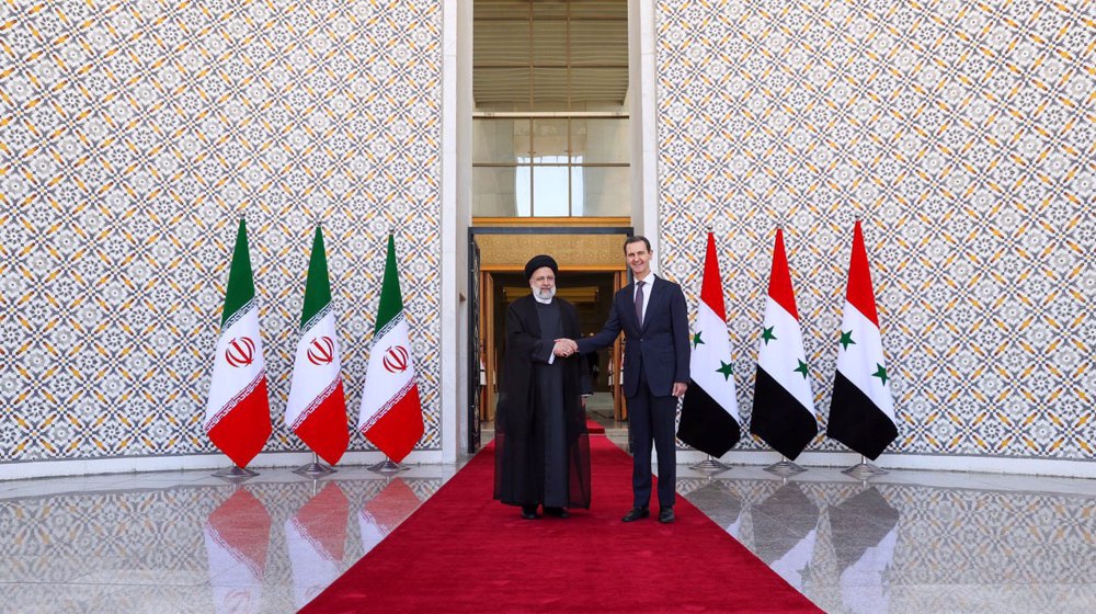 Iran’s president arrives in Syria for historic visit
