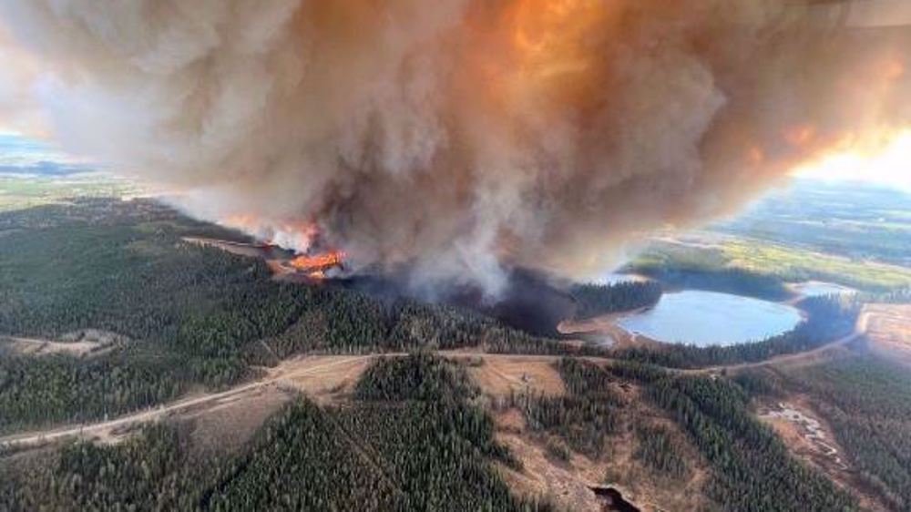 25,000 flee out-of-control wildfires in western Canada