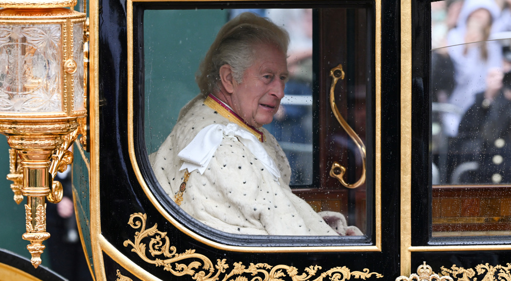 King Charles III wears crown with stolen jewels, as people chant Not My King!