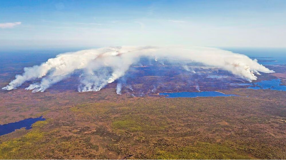Canada wildfires spread east, forcing evacuations in coastal Quebec