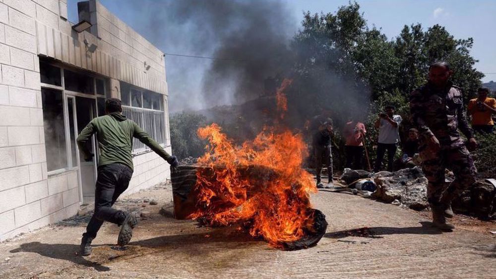 Palestinian shot dead as Israeli settlers attack West Bank town 