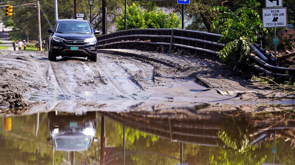 Flash floods kill four in northeastern US, as heat warnings issued for 25% of population