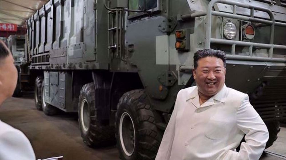 Kim urges boost of N Korea missile production amid threats by US, South 