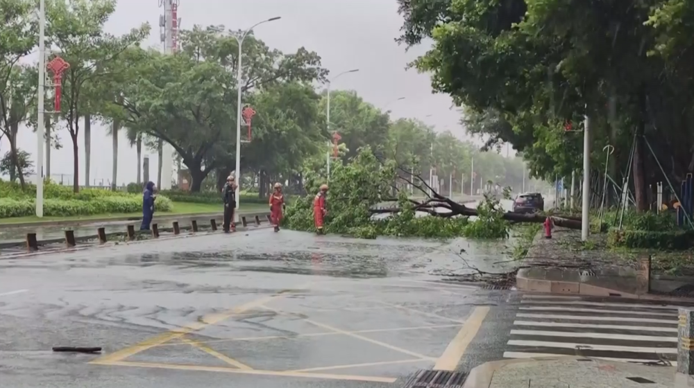 Firefighters drain waterlogged roads as typhoon-induced downpours hit Guangdong in China