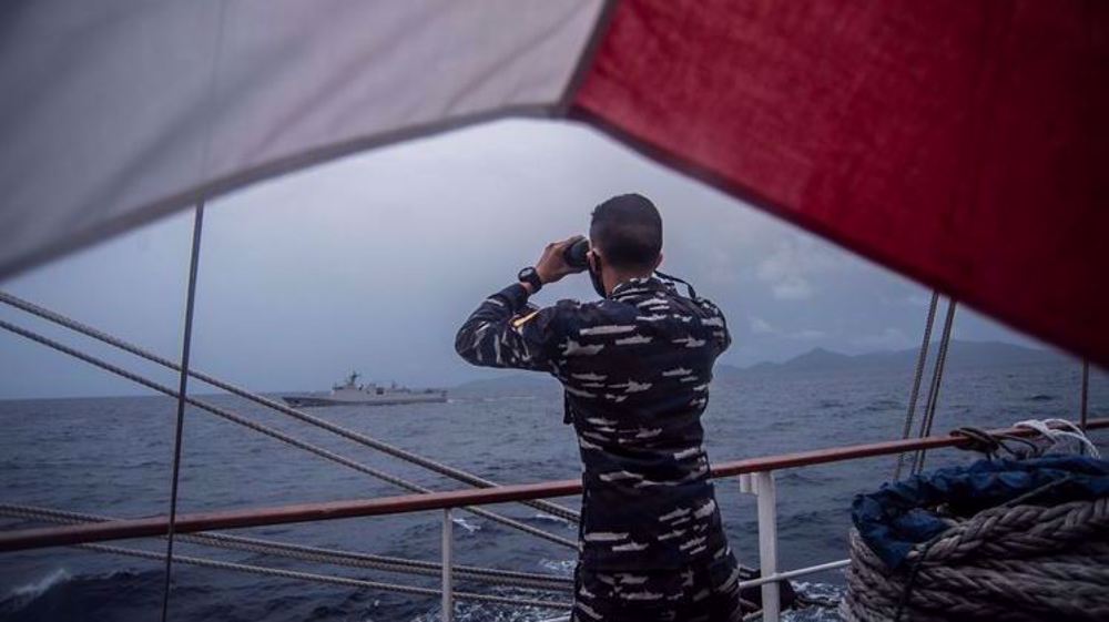 China installs satellite network on disputed reefs as ASEAN launches drills