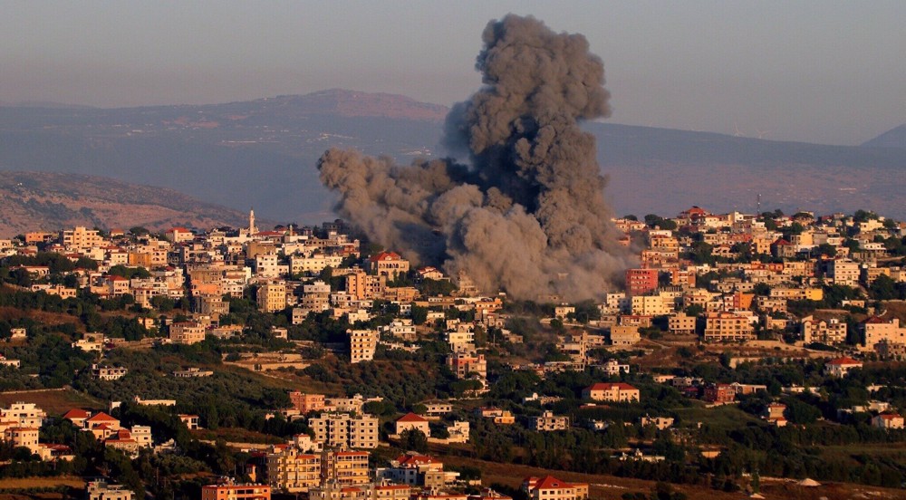 Israel expands conflict into Lebanon 