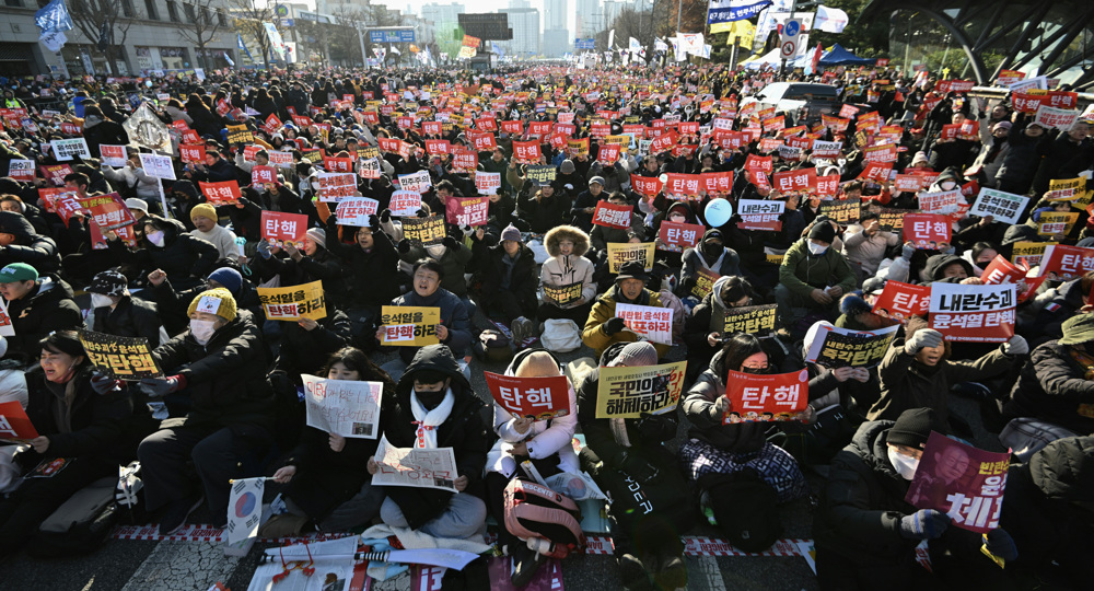 South Korean protesters rally outside parliament ahead of Yoon impeachment vote