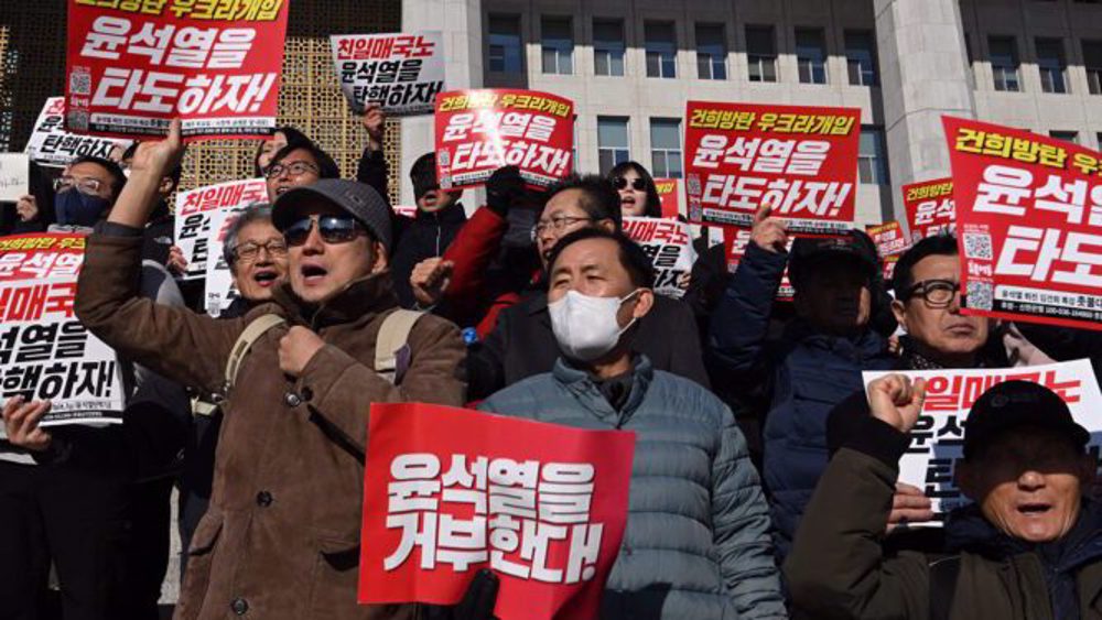 Thousands of South Korean protestors call for president to resign over martial law order