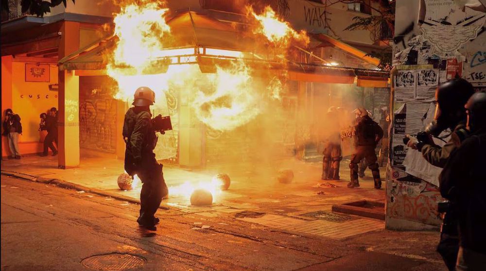 Clashes break out in Athens after march to mark 2008 student killing by police