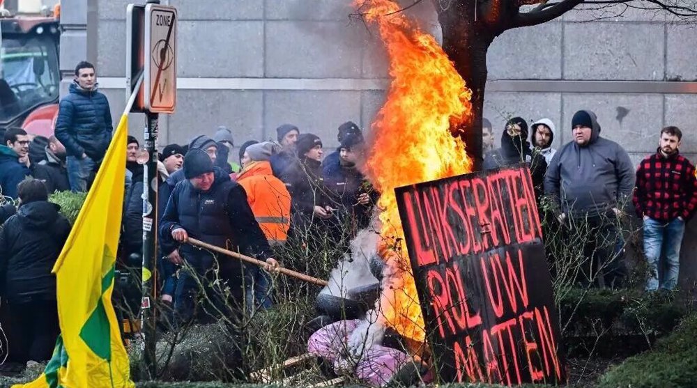 Angry farmers protest outside EU Parliament in Brussels