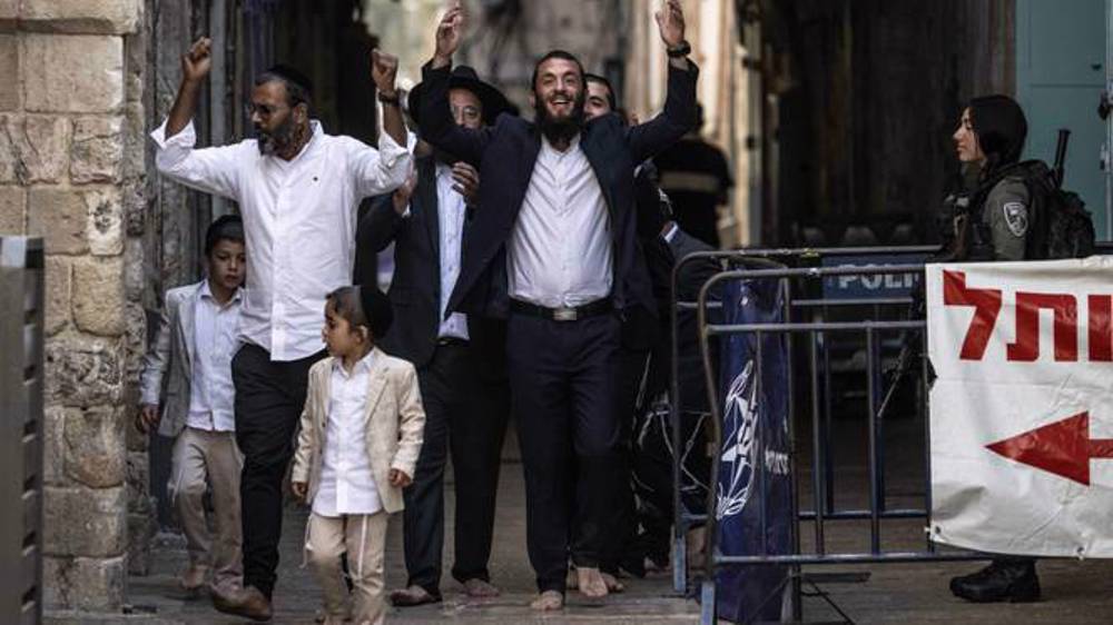 Israeli settlers – protected by military – intrude into Al-Aqsa Mosque