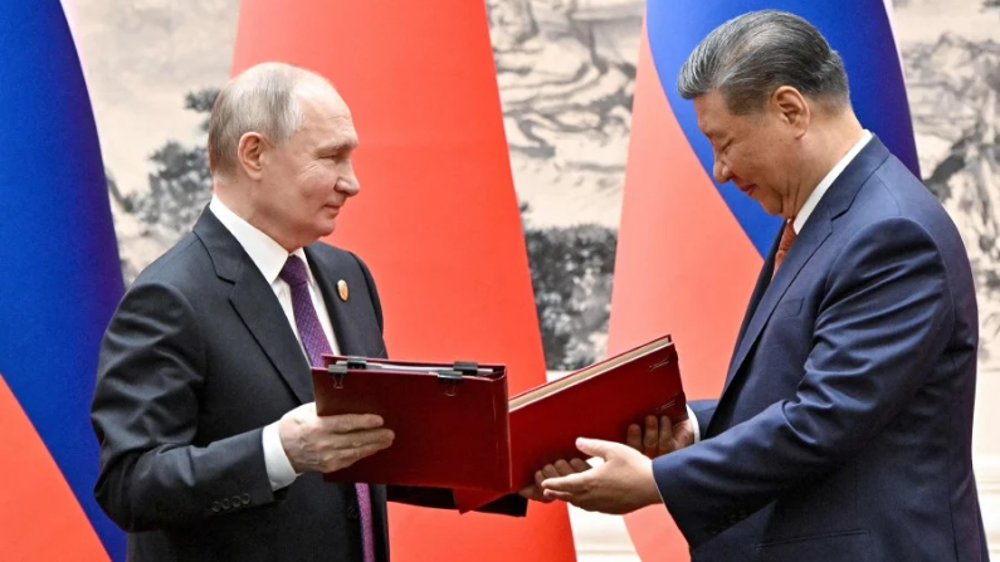 Putin in Beijing: Russia, China agree to deepen ‘strategic partnership’  