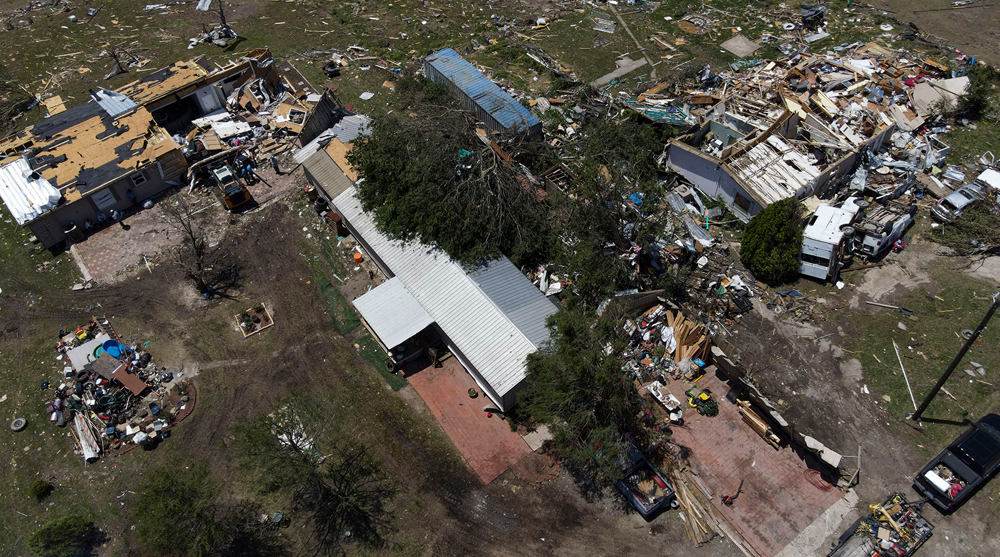 Tornadoes, storms kill at least 15 people in US