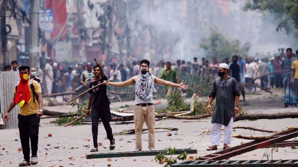 Bangladesh imposes curfew, as death toll from unrest tops 100