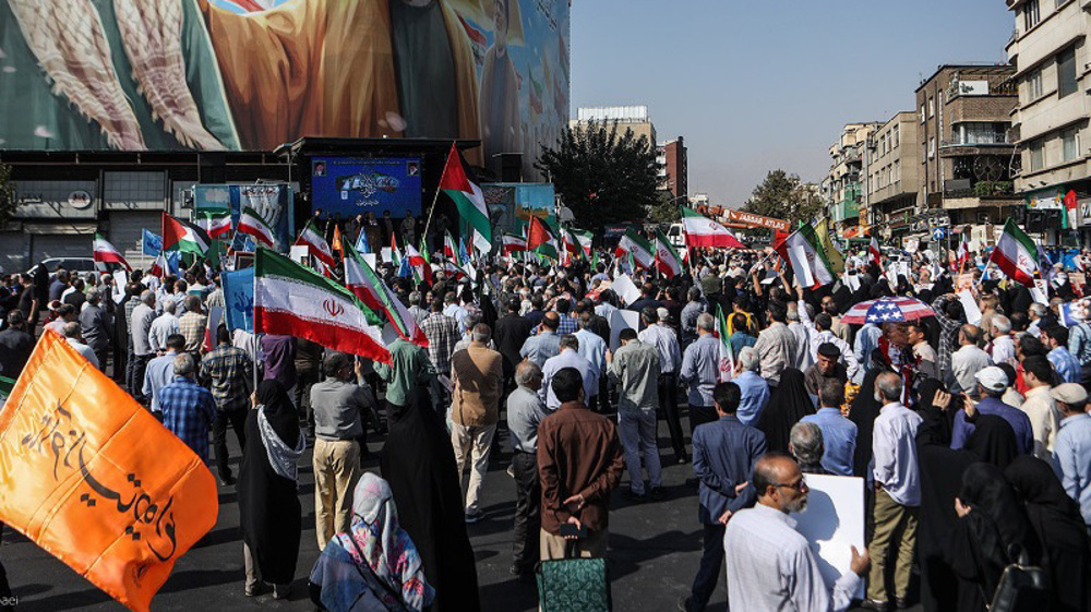 Iranians march to show support for Palestine victory