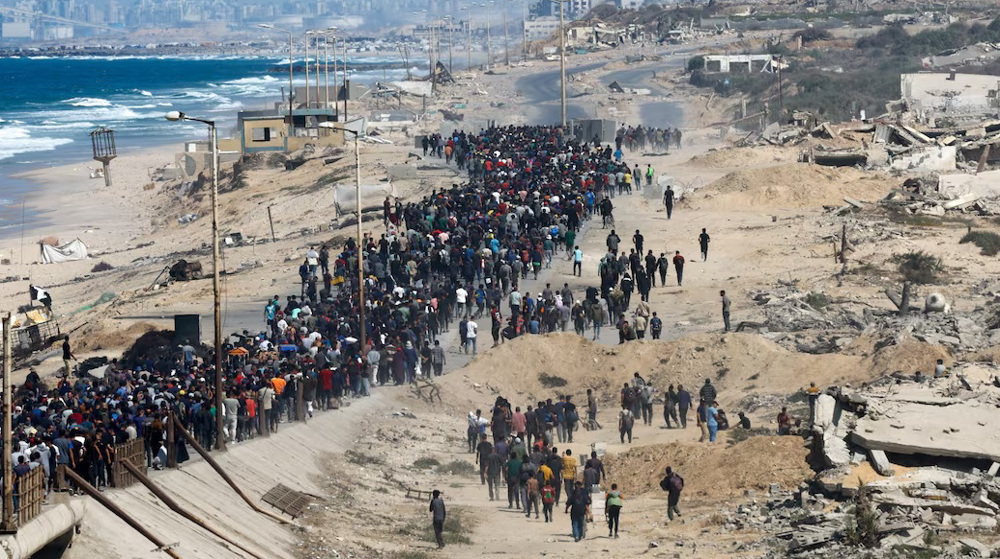 Displaced Gazans heading north to wrecked homes as Israeli troops withdraw after truce 