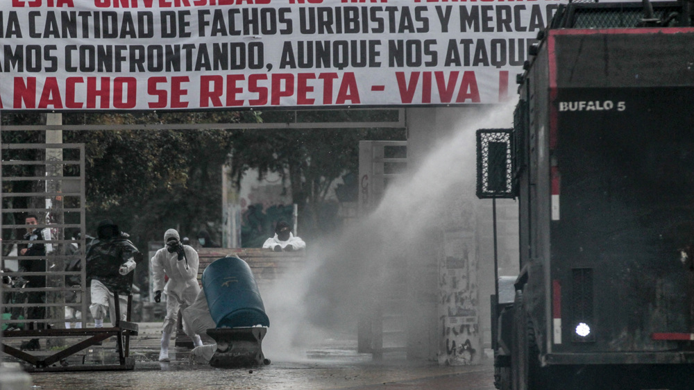 Protesters fire arrows at police near US embassy in Bogota