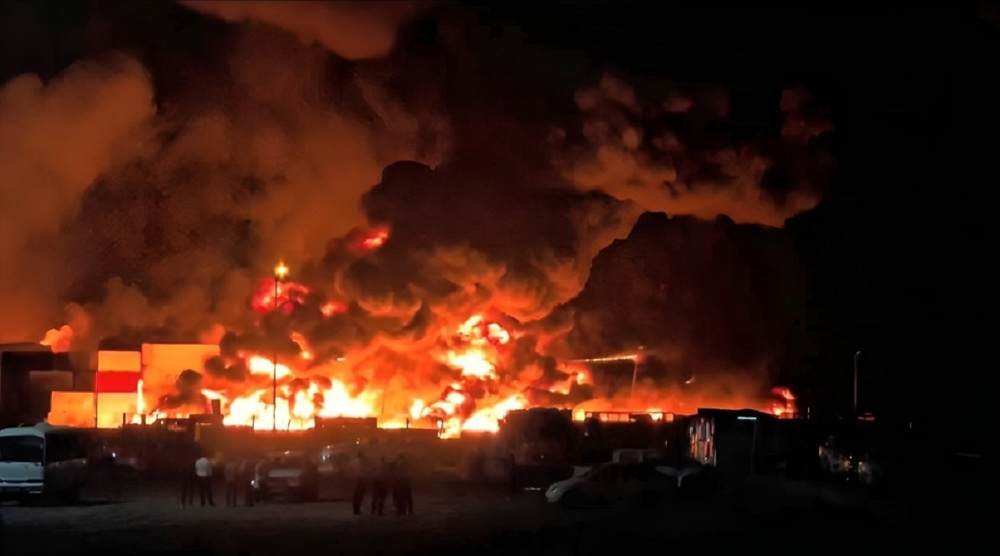 Iran declares holiday in Bandar Abbas port as fire still raging
