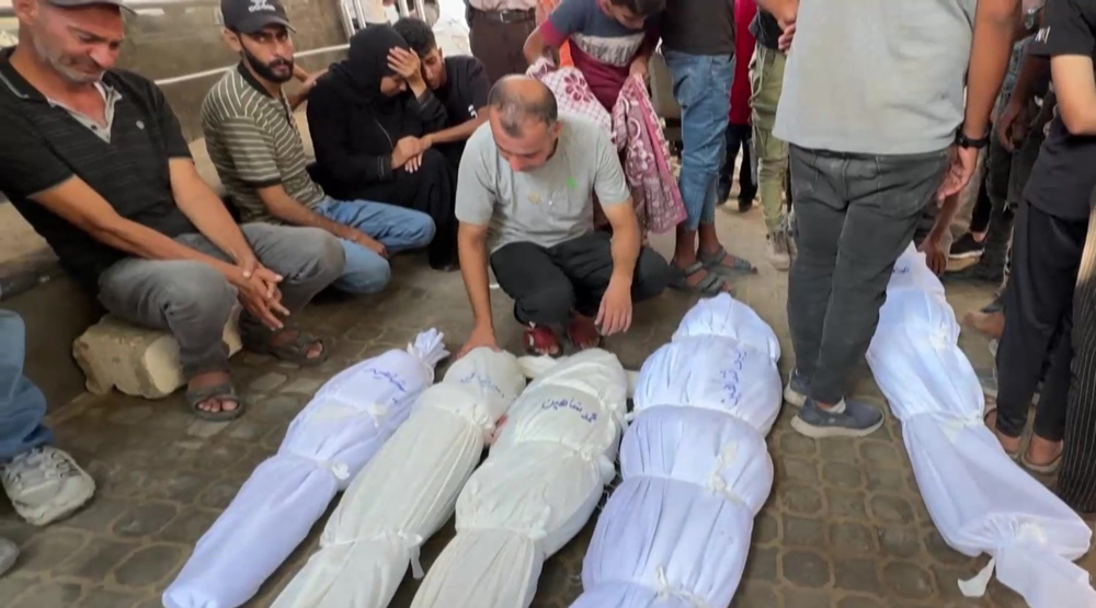 Palestinians mourn victims of strike on tent in Gaza city