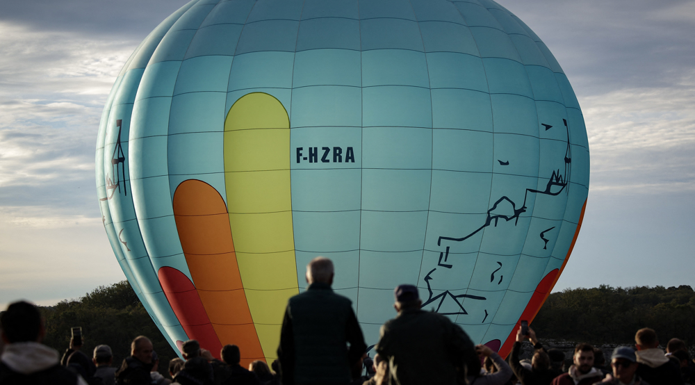 Hot-air balloons take flight over French medieval town