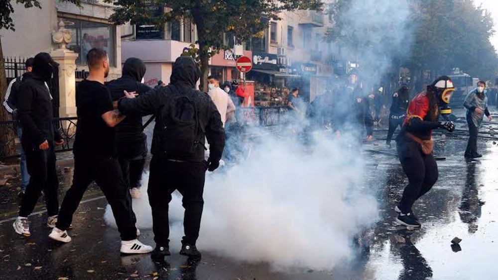 Albanians protest corruption and rising costs as police fire tear gas in Tirana