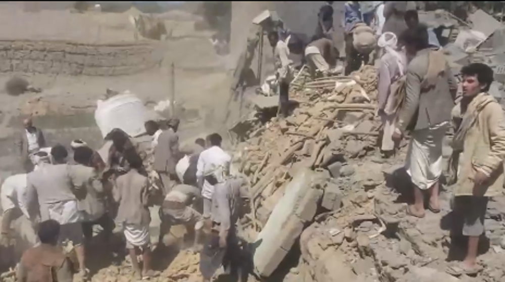 Residents pull survivors out of the rubble after Saudi strike in Yemen