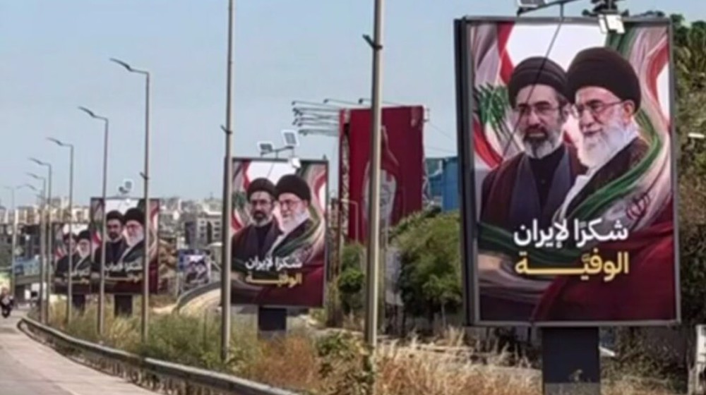 Lebanese display banners lauding Iran’s support for end to Israeli aggression on Lebanon