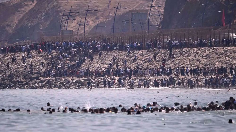At least 34 die as 60,000 cross into Spain’s Ceuta 
