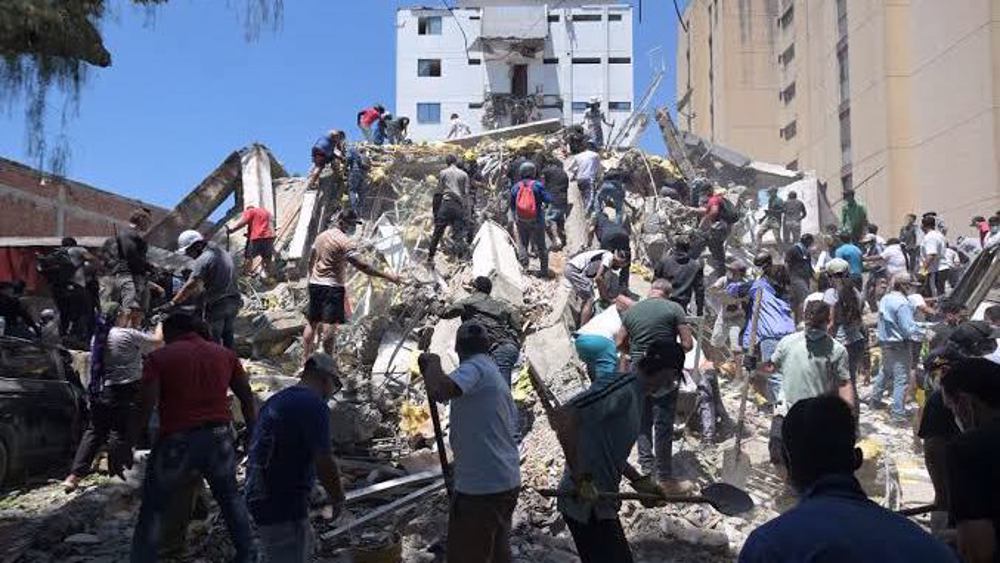 Human chains as rescue crews search for survivors in Colombia's Pereira after deadly quake