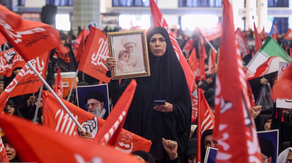 Red flags of vengeance fly as crowds mark 40th day of martyred Leader’s funeral