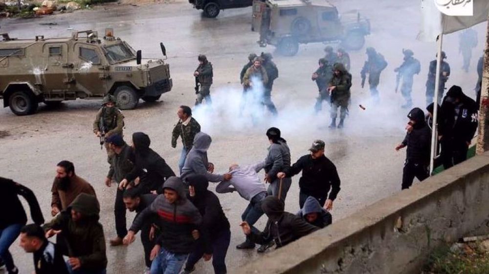 Israeli forces raid West Bank sites, abduct Palestinians as settlers attack homes, vehicles