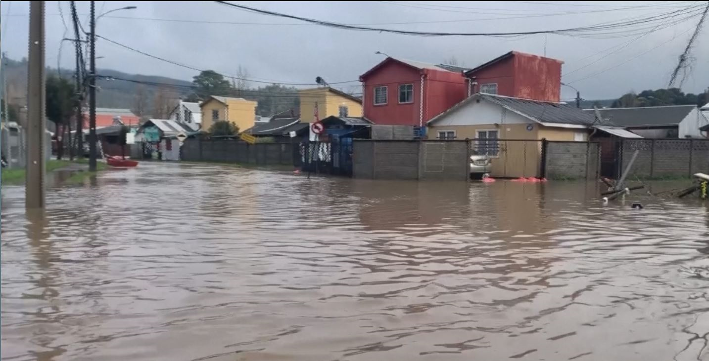 Heavy rains in Chile displace thousands, flood homes and open a sinkhole