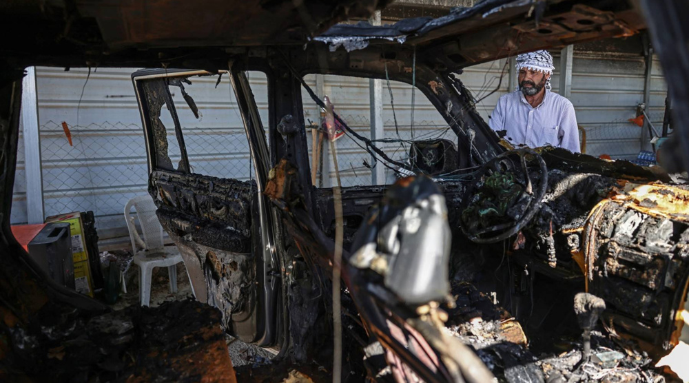 Israeli settlers torch vehicles, target Palestinian-American's home in West Bank raid
