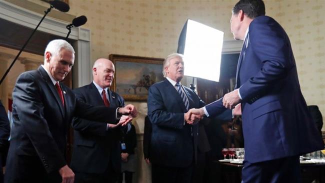 Trump gives FBI chief pat on the back