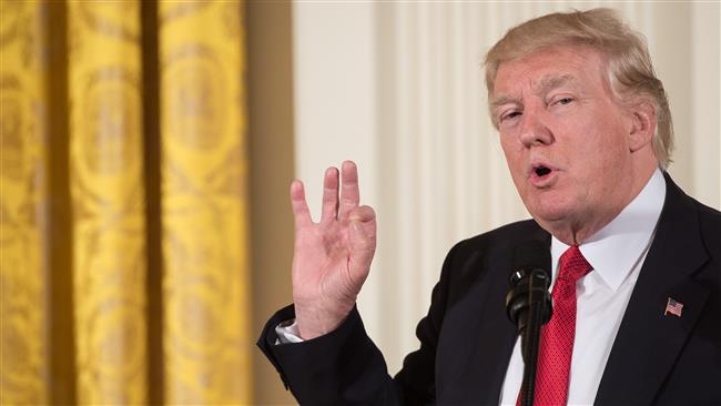 Trump signs climate order to boost coal use