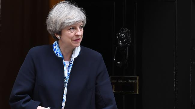 May defends decision to hold snap election