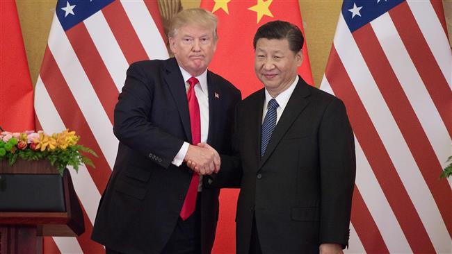 In China, Trump says N Korea must totally denuclearize