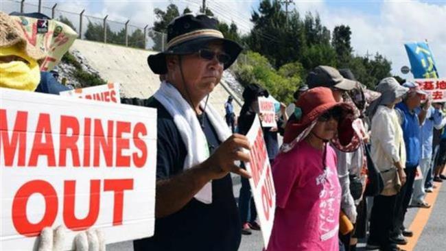 Japanese in Okinawa stage protests against US military presence in island