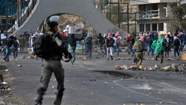 Israeli troops clash with anti-Trump Palestinian protesters