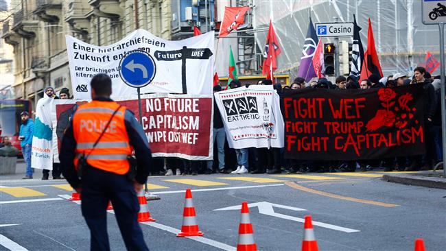 Anti-Trump demonstrators march in Swiss capital