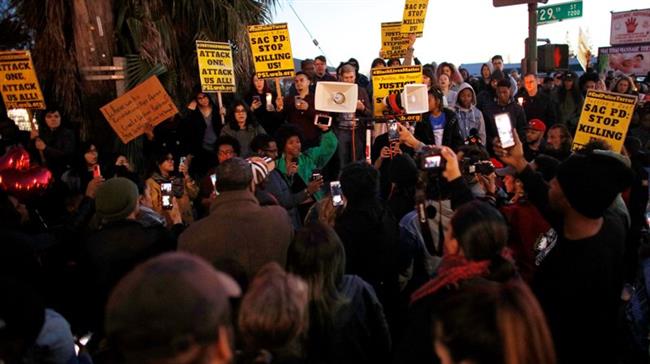 Protesters march over police shooting of unarmed black man