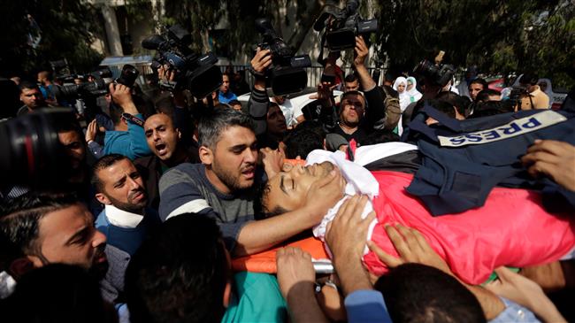 Funeral held for Palestinian journo killed in protests