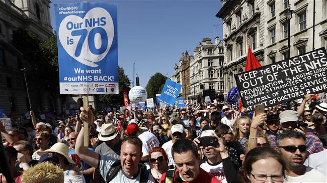 Thousands protest NHS funding: Cuts leave scars 
