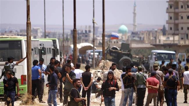 Syria militants begin leaving Dara'a under surrender deal